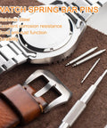 Heavy Six Pack Stainless Steel Watch Spring Bars 1.5 X 19mm with a watch and toolkit on a brown surface.