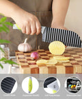 Side view of VRUIFA crinkle fry cutter with non-slip ergonomic handle slicing a potato on a wooden board