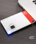 ATKey Card Fingerprint Security Key With FIDO2 Certification USB A NFC And Bluetooth For Online Accounts Including Azure Microsoft 365 Google Salesforce Facebook Twitter Apple And More next to laptop