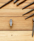 Badass Hydraulic Grease Fitting Brass Coupler Adapter For Factory Work Use With Forged Steel Components Building Long Life Reliability Plus Fast Oil Injection Via Grease Nipple Connection Fits Best For Garage Shop Crews Working Hard Every Day, silver grease adapter on wooden workbench