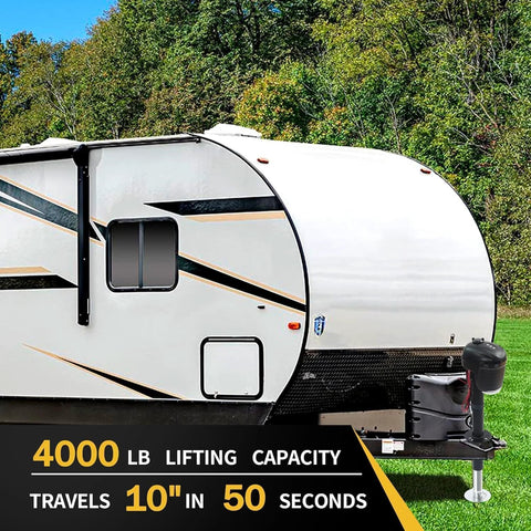 12V electric RV tongue jack, black, mounted at the front hitch of a white travel trailer.