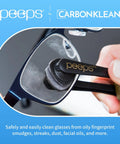 Front view of Peeps by CarbonKlean eyeglass lens cleaner; black wand with gold Peeps logo cleaning glasses lens