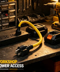 Heavy Duty 12 Awg Nema Four In One Adapter Cable Electrical Power Extension Cord With 15 Amp 125 Volt Plug connecting devices on a workbench.