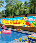 Hello Summer Banner 118 By 20 Inches Outdoor Beach Theme Party Decor With Flamingo And Tropical Fruit Design visible at poolside.