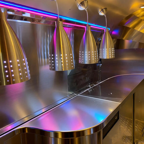 Turnkey Electric Mobile Food Truck Trailer For Sale Featuring Customizable Layout And Zero Hassle Setup, sleek stainless steel kitchen interior.