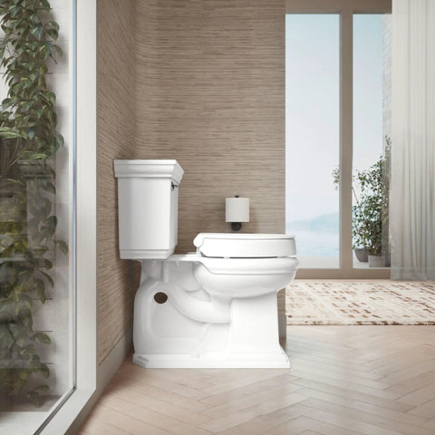 Hyten 3 Inch Elevated Soft Close Round Toilet Seat in a modern bathroom with natural lighting and plants