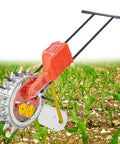 Manual Seeder Hand Push Roller Seeder Seed Dispenser Garden Tool For Terraced Farms Ranches And Backyards amid young plants