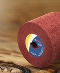 Nonwoven Flap Wheel for Surface Conditioning 120 Grit Drum 120 x 100 x 19 mm on a wooden surface