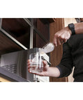Person using Side Tank Accessory For Opal Nugget Ice Maker With Magnetic Attachment 1 Gallon Tank for more ice