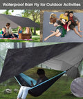 Camping Hammock With Built In Mosquito Net And Rain Fly, Heavy Duty Tree Straps, Nylon Parachute Fabric, One Piece Design shown in forest