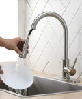 Brushed Nickel Kitchen Faucet With Pull Down Sprayer High Arc Single Handle Stainless Steel Sink Faucet In Use Washing Plate