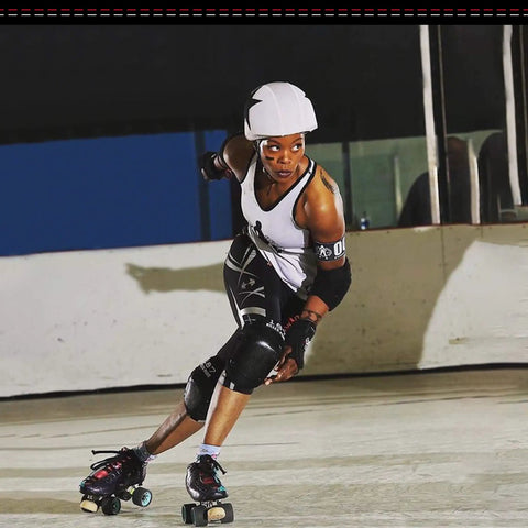 Roller skater wearing Slim Knee Pad Black Medium With Fusion Groove Channel And Memory Foam for outdoor skating