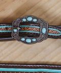 Western Horse Headstall And Breast Collar Tack Set Crafted From Genuine Argentina Cowhide Leather With Geometric Tooling turquoise buckle close-up.