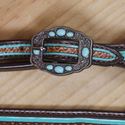 Western Horse Headstall And Breast Collar Tack Set Crafted From Genuine Argentina Cowhide Leather With Geometric Tooling turquoise buckle close-up.