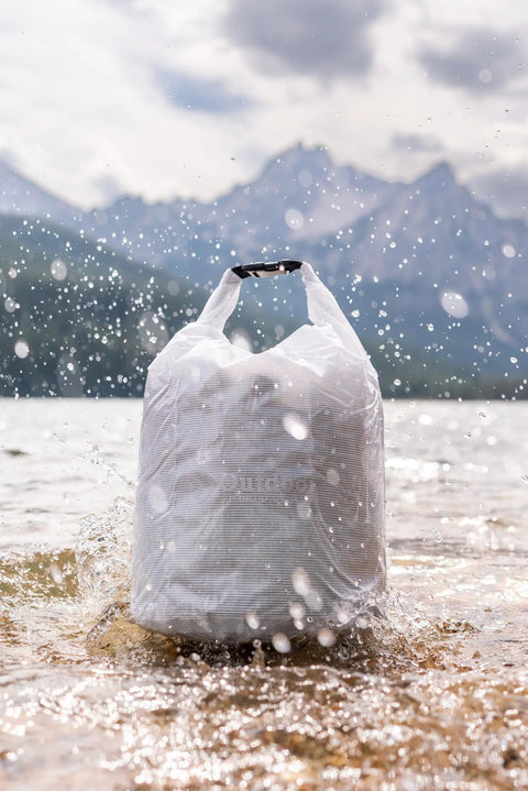 Valuables Dry Bag 20 Liter Surf Waterproof Roll Tight Closure With Transparent Vinyl and Welded Seams splashing in water