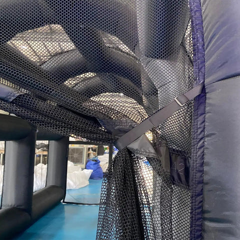 Interior view of Inflatable Tennis Court Style Tent And Baseball Batting Cage with blower, showing durable netting inside the frame.