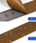 Close-up of PTFE Teflon High Temperature Tape for Heat Sealers, showing nonstick adhesive, waterproof feature, measured on a ruler.