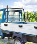 Rock Solid Trailer Stake Pocket Brackets 12 Pack Heavy Steel Inserts on a blue truck bed for secure load containment.
