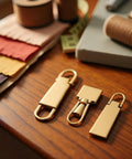 Gold Zipper Pull Replacement Set Pro Grade Four Metal Zipper Handles For Luggage Bags Backpacks Jackets Boots And Coats Quick Easy Fix For Broken Zippers Durable Metal Construction Sewing Notions And Supplies on wooden table