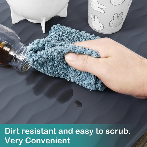 Person cleaning Under Sink Mat Silicone Waterproof 31x22 Inches for Kitchen and Bathroom, oil-resistant, dark grey