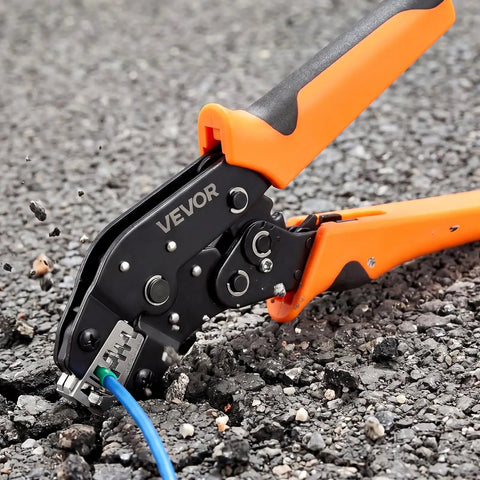 No Sweat Ratcheting Wire Crimper Pliers For 24 To 12 AWG Terminals, shown on asphalt with wire visible, ideal for electrician use.
