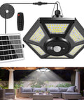 Solar Shed Light Outdoor Pendant With 180 LED 1000 Lumen Brightness Motion Sensor And Remote Control shown in patio setting.