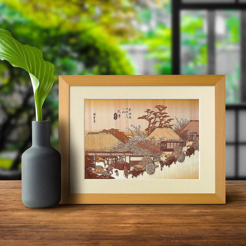Ukiyoe Art Kit Kiharie The Running Well Teahouse At Otsu By Hiroshige Made In Japan, framed artwork on wooden table with vase.