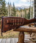 Vintage Leather No Drill Cheek Rest For Rifles And Shotguns With Buttstock Protective Pouch in outdoor setting