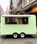 Kickstart Your Food Truck Hustle With This Turnkey Mobile Kitchen Trailer Featuring Plug And Play Electrical And Nsf Stainless Steel Counters Perfect For Sliders Coffee And Quick Cash Flow, shown from the rear with green exterior.