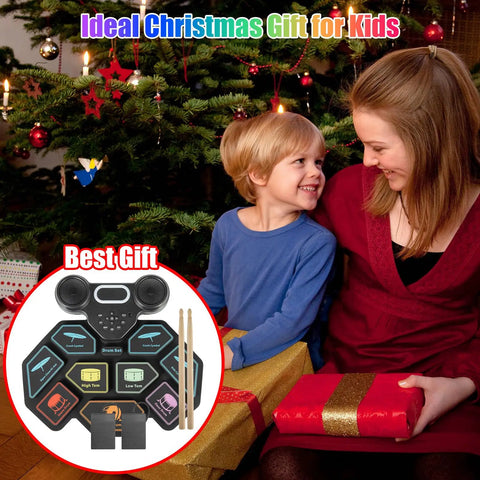 Child receiving 9-Pad Roll-Up Electronic Drum Set With Portable Silicone Pads gift by Christmas tree.