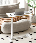 Overbed Table With Pneumatic Lift, Adjustable Height 26 To 41.7 Inches, Hidden Casters, used as mobile laptop desk by sofa