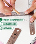 Person using Metal Straight Edge Ruler Set With 4 Stainless Steel Rulers In 6 Inch, 8 Inch, 12 Inch And 14 Inch For Your Drafting, Drawing, And DIY Projects, Imperial And Metric Measurements With 1/64 Inch And 1/20 Cm Etched Marks on paper