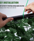 Hands installing Faux Ivy Privacy Fence Screening Expandable Outdoor Greenery Roll Easy Install For Garden And Patio Realistic
