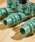 Heavy Duty 3 Valve Preassembled Irrigation Manifold With Swivel Unions for drip irrigation on wooden surface