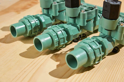 Heavy Duty 3 Valve Preassembled Irrigation Manifold With Swivel Unions for drip irrigation on wooden surface