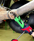 Beefy Heavy Duty U Joint Puller for Intermediate Trucks Buses and Farm Equipment in use on a vehicle driveshaft