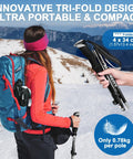 Hiker using Lightweight Collapsible Trekking Poles With Telescopic Tri Fold Design Aluminum 7075 Walking Sticks in snow landscape.
