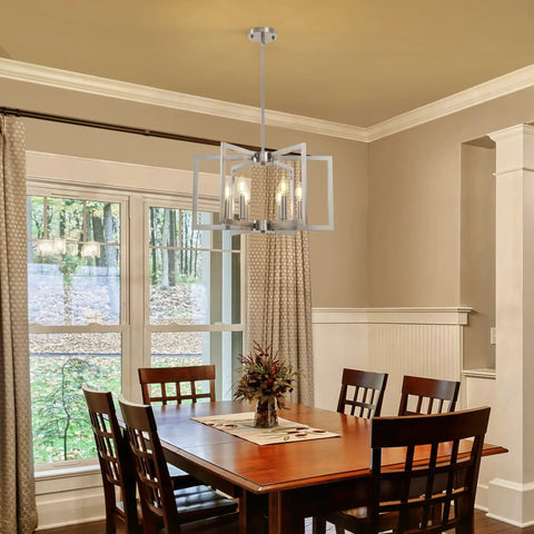 Top Tier Six Light Modern Metal Geometric Chandelier In Sleek Brushed Nickel above a wooden dining table in a cozy setting.