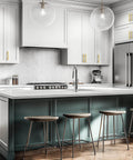Kitchen with Brushed Brass Cabinet Handles With 3-3/4 Inch Hole Spacing, Stainless Steel Drawer Pulls For Cabinets, Kitchen, Bathroom, And Dresser, Rust Resistant, 5 Pack By Home Edit installed on white cabinets.