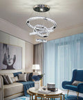 LED Crystal Chandelier With 4 Ring Design, Modern Stainless Steel Pendant Light in living room with blue accents
