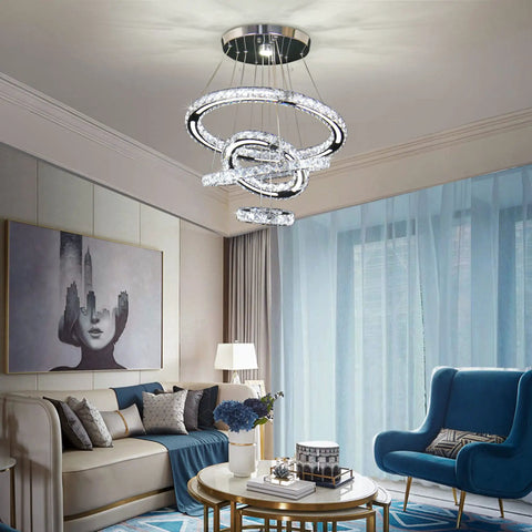 LED Crystal Chandelier With 4 Ring Design, Modern Stainless Steel Pendant Light in living room with blue accents