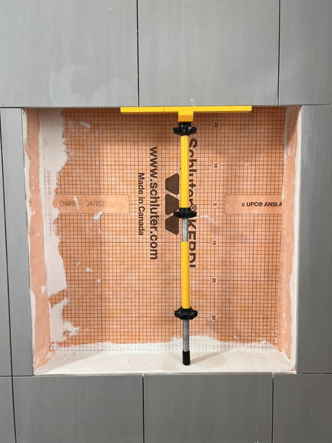 Shower Niche Tiling Tool Kit With Aluminum Support For Ceramic And Porcelain Tile Installations in use on niche wall