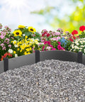 Garden flowers with gray stone mulch bordered by landscape stakes for lawn edging using 30 Pack 10 Inch Garden Landscape Stakes.