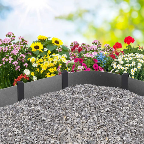 Garden flowers with gray stone mulch bordered by landscape stakes for lawn edging using 30 Pack 10 Inch Garden Landscape Stakes.