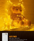 Battery Operated Fairy Lights 10Ft 120 LED Firecracker String Lights With 6 Hour Timer illuminating a teddy bear display
