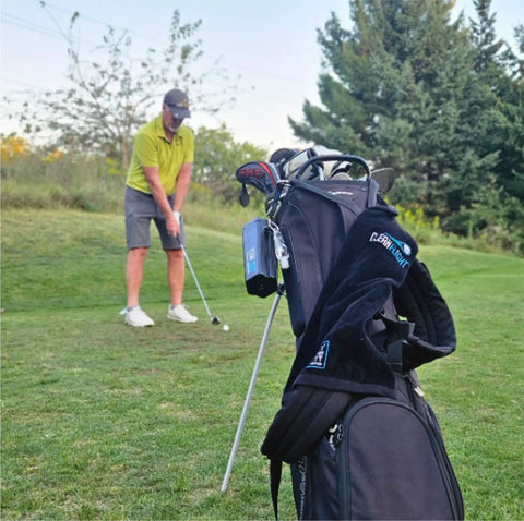 Premium Golf Ball Washer With Variable Hex Brush System Portable Ball Cleaner attached to golf bag on course