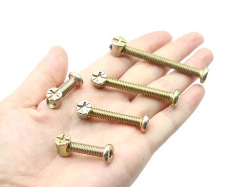 Heavy Duty Crib Hardware Replacement Kit M6 Barrel Nuts And Hex Socket Bolts With Wood Dowel Pins 70 Piece Set, assorted hex bolts in hand.