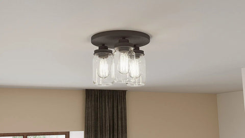 Close-up of 3-Light Textured Black Flush Mount with Faux Mahogany Wood Accents, Clear Glass Mason Jar Shade with Dope Rustic Lid