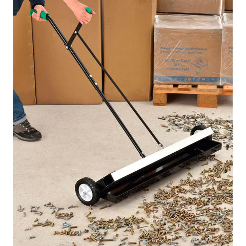 Built Different Heavy Duty 36 Inch Floor Magnetic Sweeper With Quick Release Lever For Warehouses And Shop Floors Picks Up Steel Scrap And Hardware Cleanup Rocks in use on workshop floor.