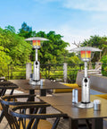 Outdoor Propane Patio Heater 11,000 BTU Portable Tabletop With Weighted Base Stainless Steel on restaurant patio.